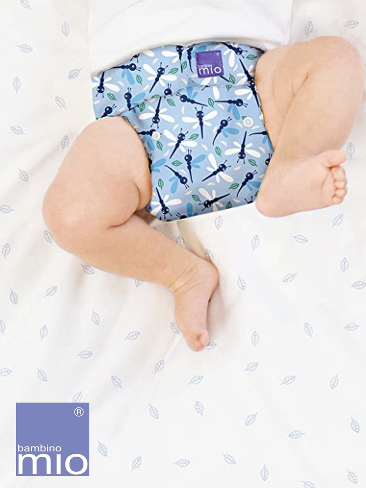 a baby laying down wearing miosolo bambino mio cloth diaper