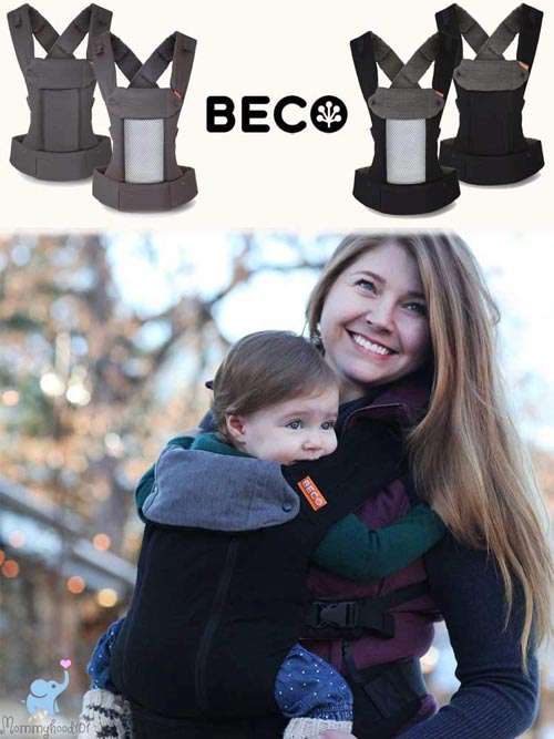 woman carrying a baby in a beco 8 baby carrier in an autumn scene