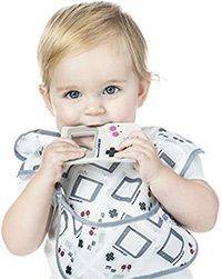 a baby chewing on the bumkins nintendo game boy silicone teether