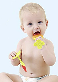 a baby enjoying the tinabless fruit series teether