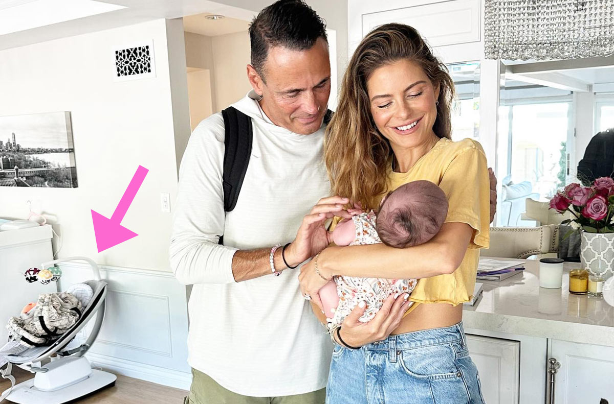 Maria Menounos and Keven Undergaro holding baby Athena with the 4moms mamaroo in the background
