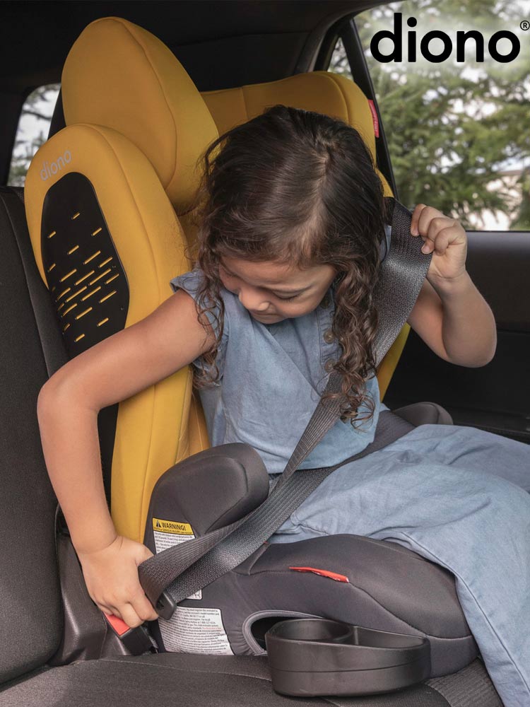 a young girl buckling her own seat belt while sitting in the diono monterey 4 dxt booster