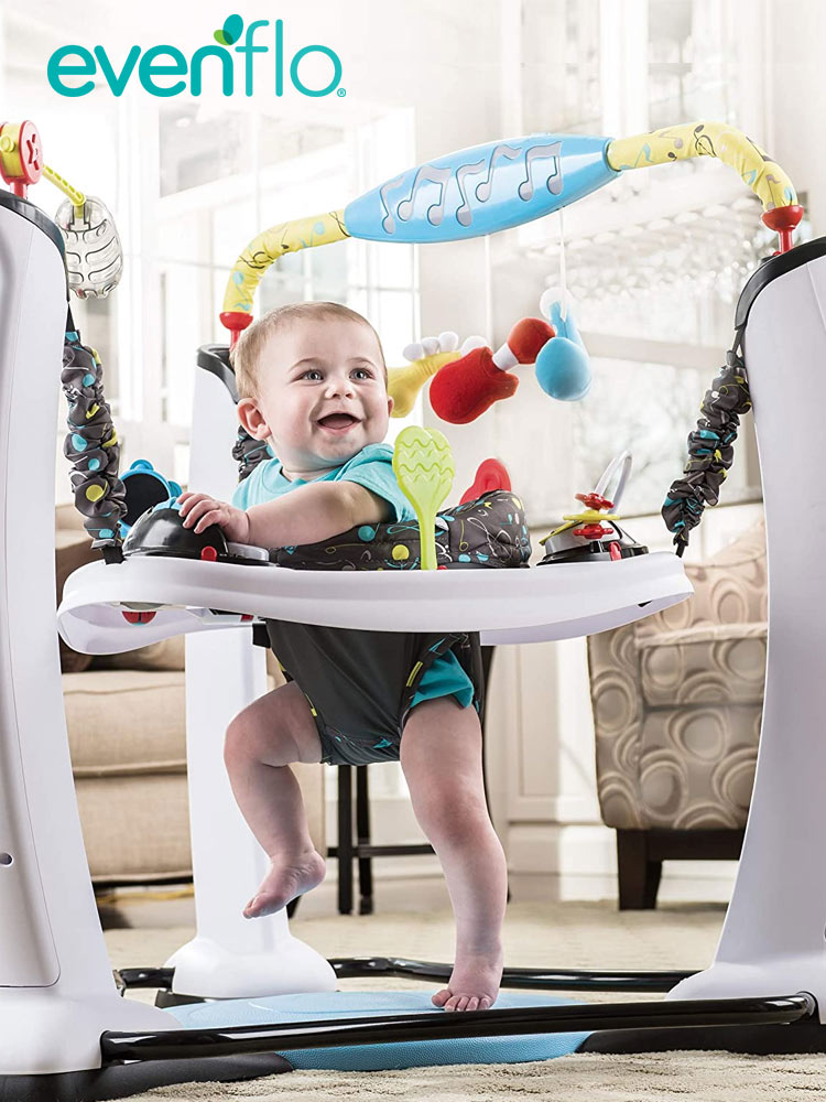 a smiling baby boy playing in the evenflo exersaucer jump and learn