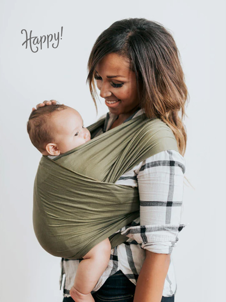 mom carrying a baby in a green happy baby wrap