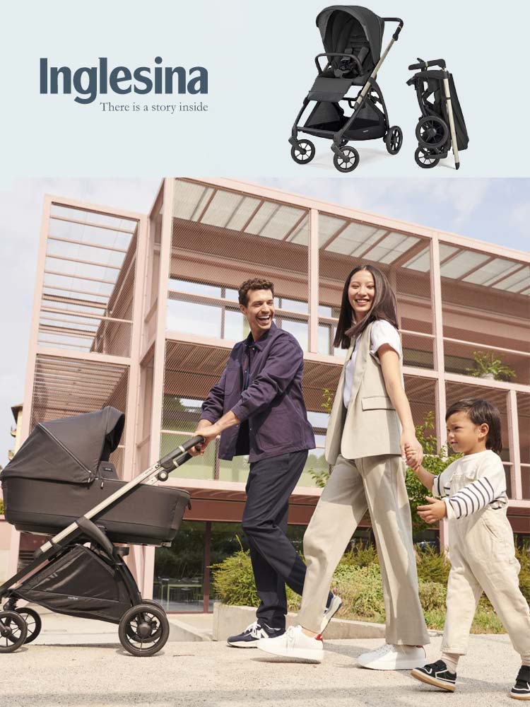 parents walking in a modern background with toddler and pushing baby in the inglesina electa stroller
