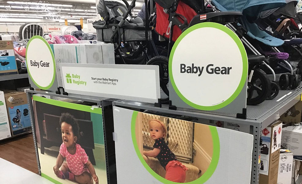 an aisle of baby gear in a store