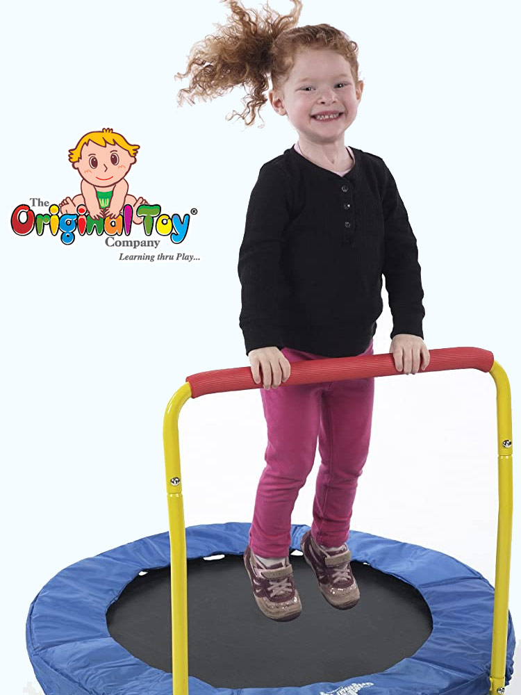smiling young girl jumping on the original toy company trampoline