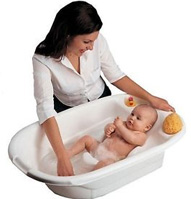 a mother bathing a baby in the primo eurobath bathtub