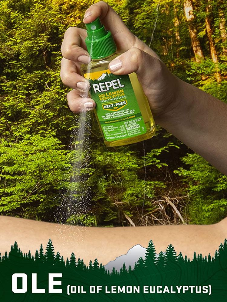 the repel lemon eucalyptus insect repellent being sprayed in the forest