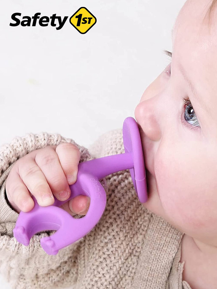 a baby chewing on a safety 1st mombella ellie the elephant teether