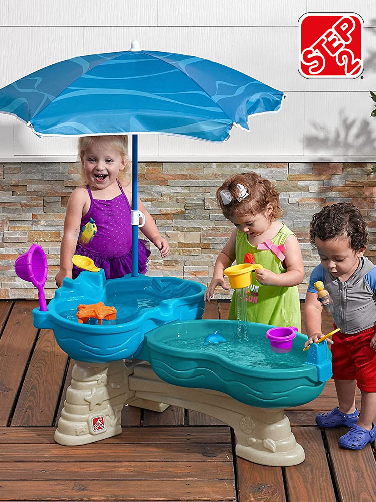 kids playing on a water table