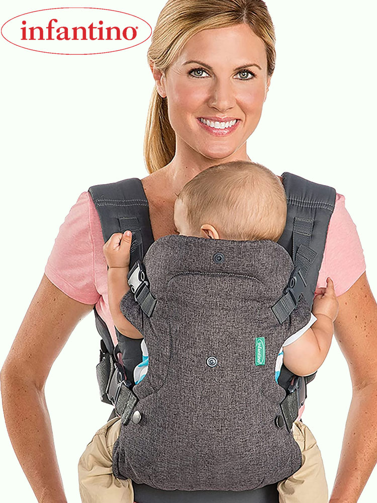 a mother carrying a newborn baby in an infantino flip baby carrier