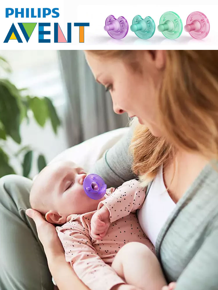 a mom holding a newborn baby who is sucking on a philips avent soothie pacifier