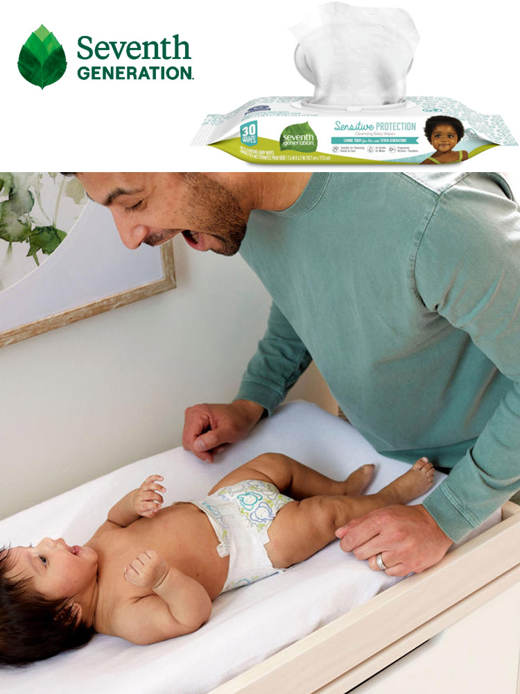 a package of seventh generation baby wipes and a father changing a baby diaper