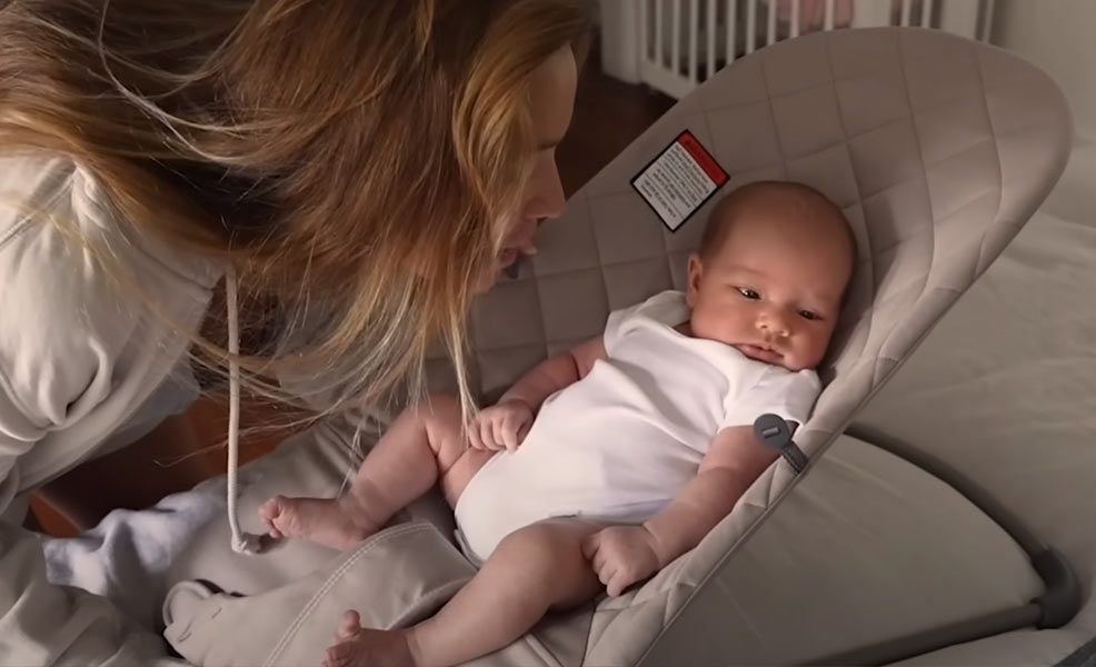 tia blanco with baby sitting in a babybjorn bouncer seat