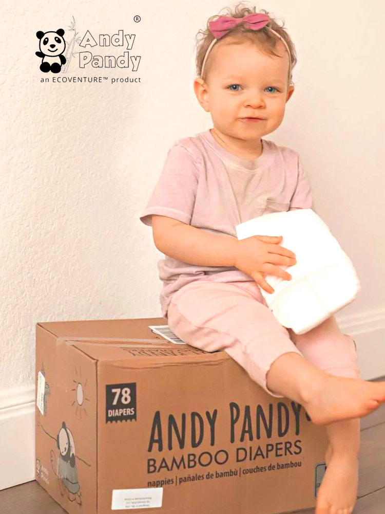 toddler sitting on a box of andy pandy bamboo diapers