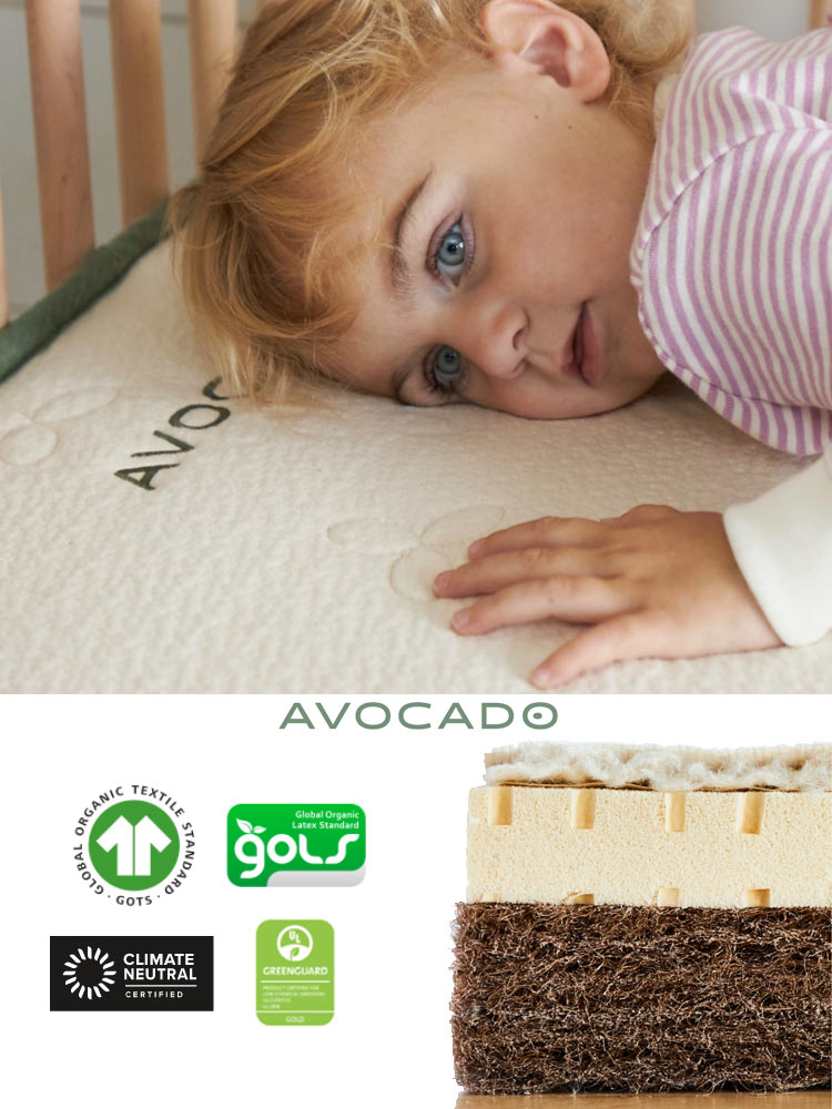 the avocado green crib mattress with child laying on top and a cross section of the mattress