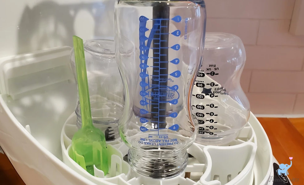 clean bottles after the baby brezza bottle washer pro washing and sterilization cycles