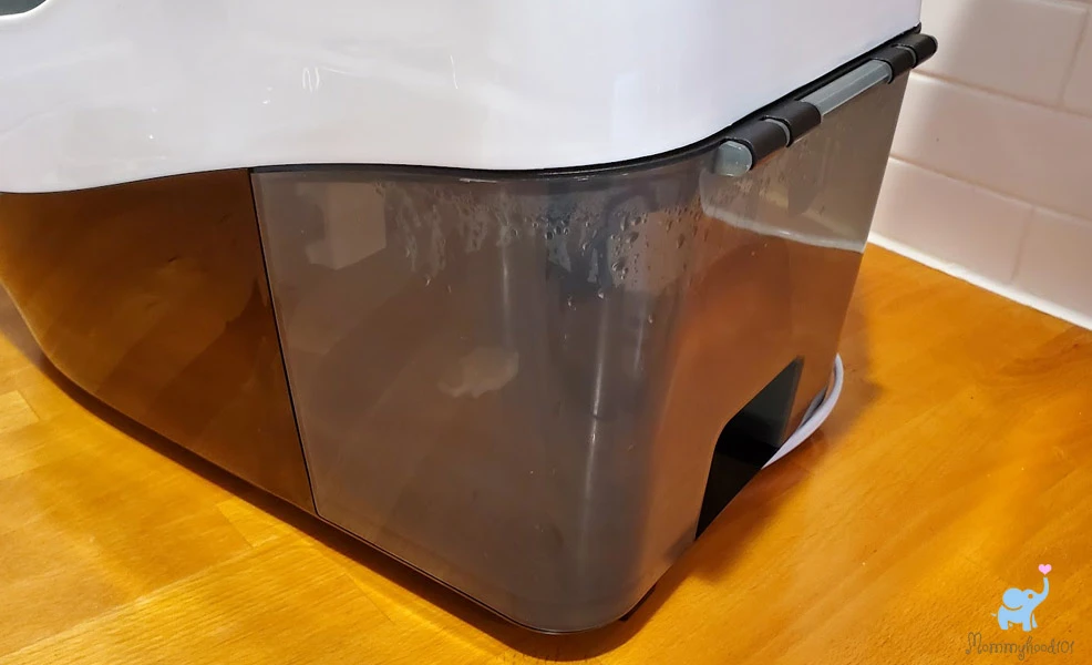 emptying waste water bin on the baby brezza bottle washer pro