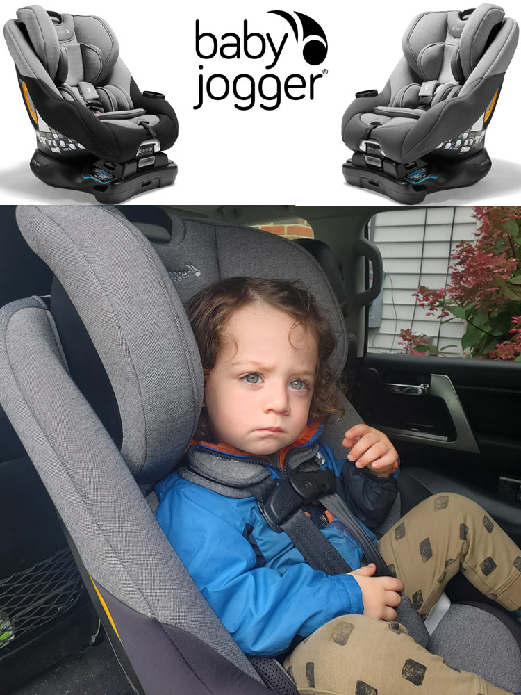toddler boy sitting in the baby jogger city turn car seat