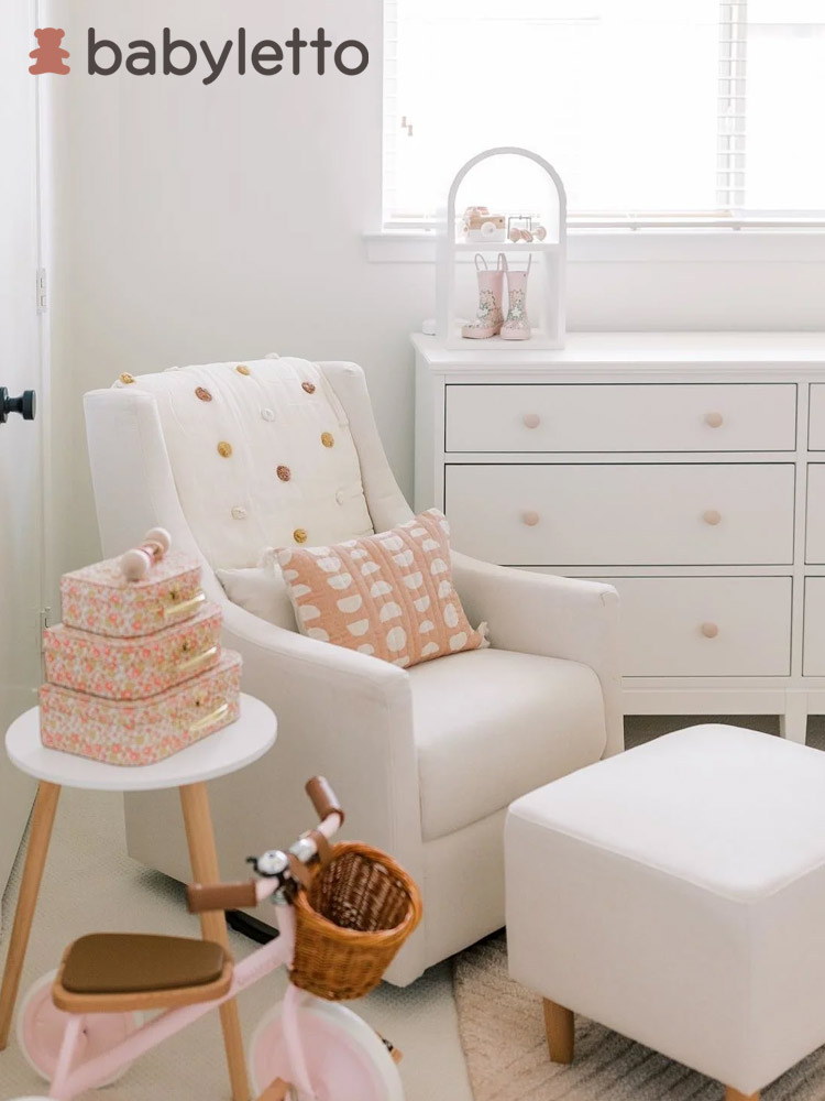 the babyletto toco swivel glider in a nursery