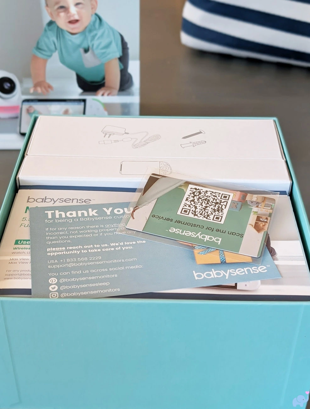 Babysense MaxView Pro unboxing process showing the individually boxed monitor components