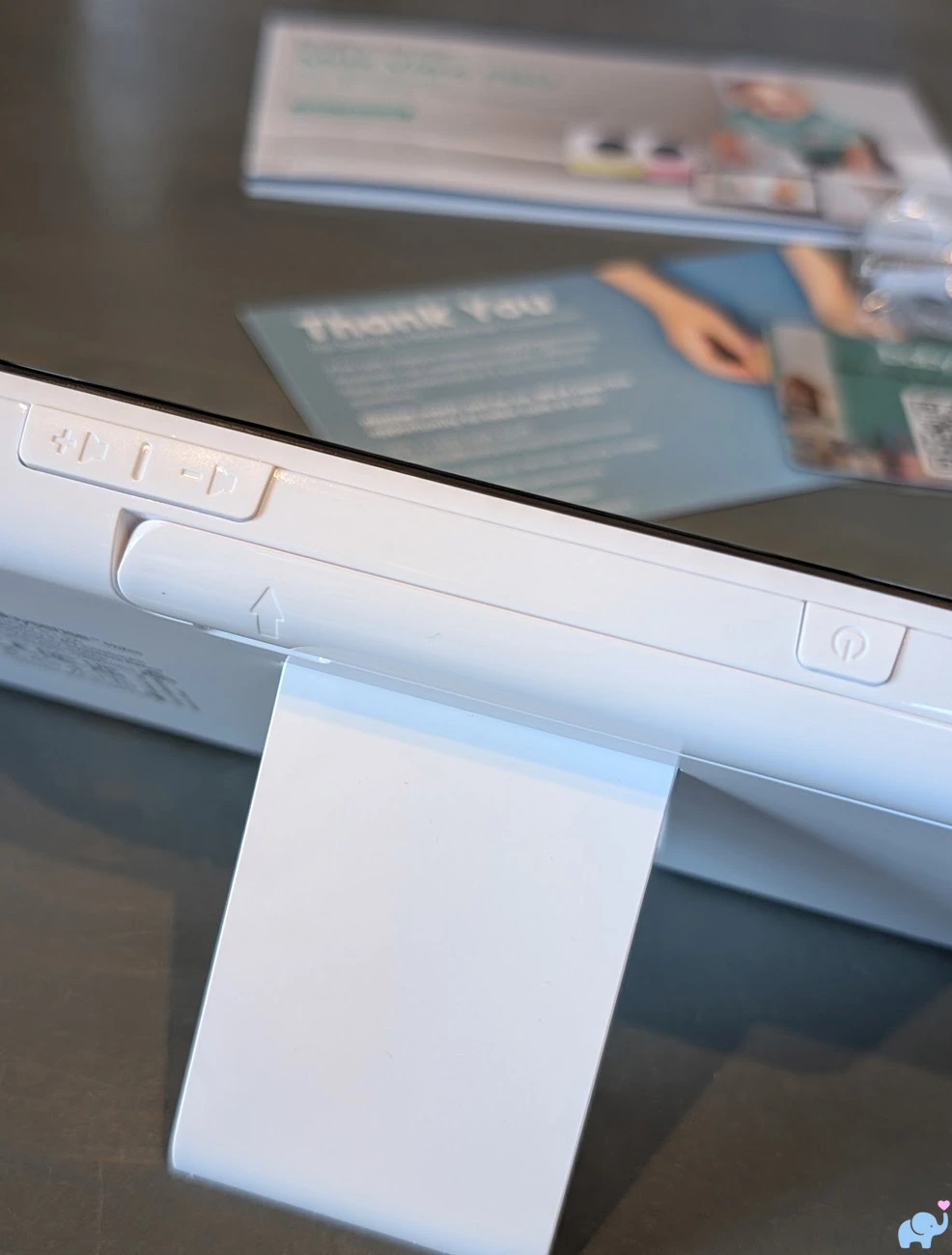 Top edge of the Babysense MaxView Pro parent unit showing volume buttons power button and folding antenna