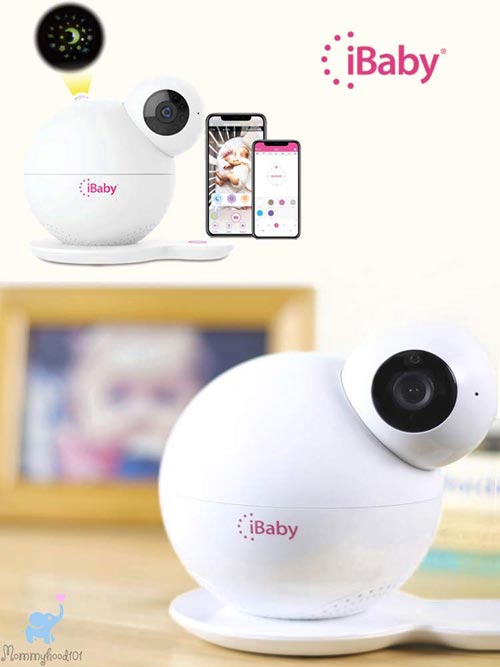 ibaby care m7 baby monitor showing the star projector feature and two smartphones with the ibaby app