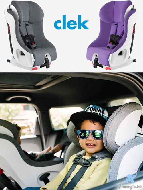 two children sitting in clek foonf car seats one installed forward facing and one rear facing