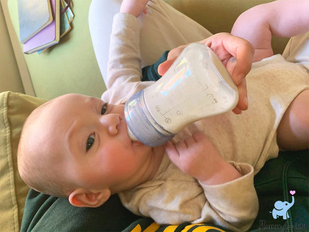 bottle feeding a baby with the bobbie formula