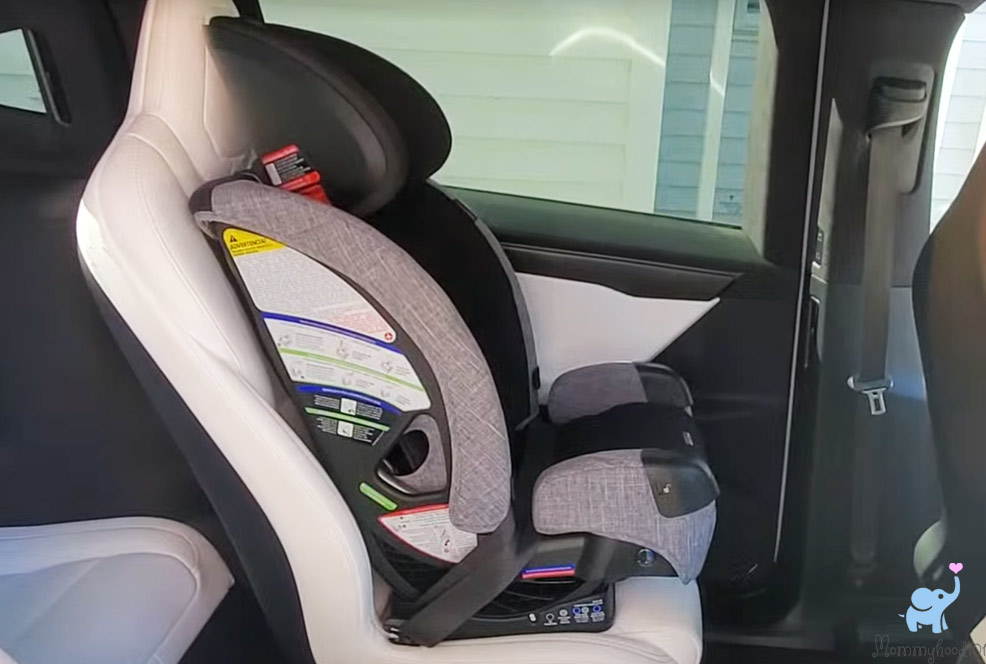 baby sitting in the britax one4life slim car seat installed in booster mode