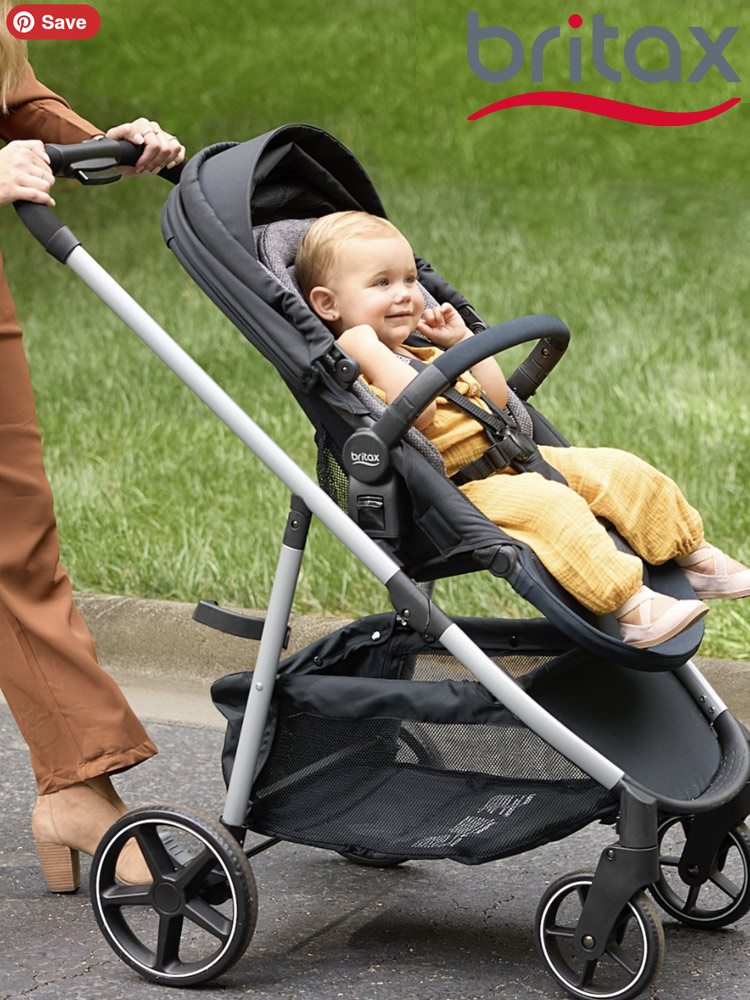 a mom pushing the britax willow grove sc travel system in an park