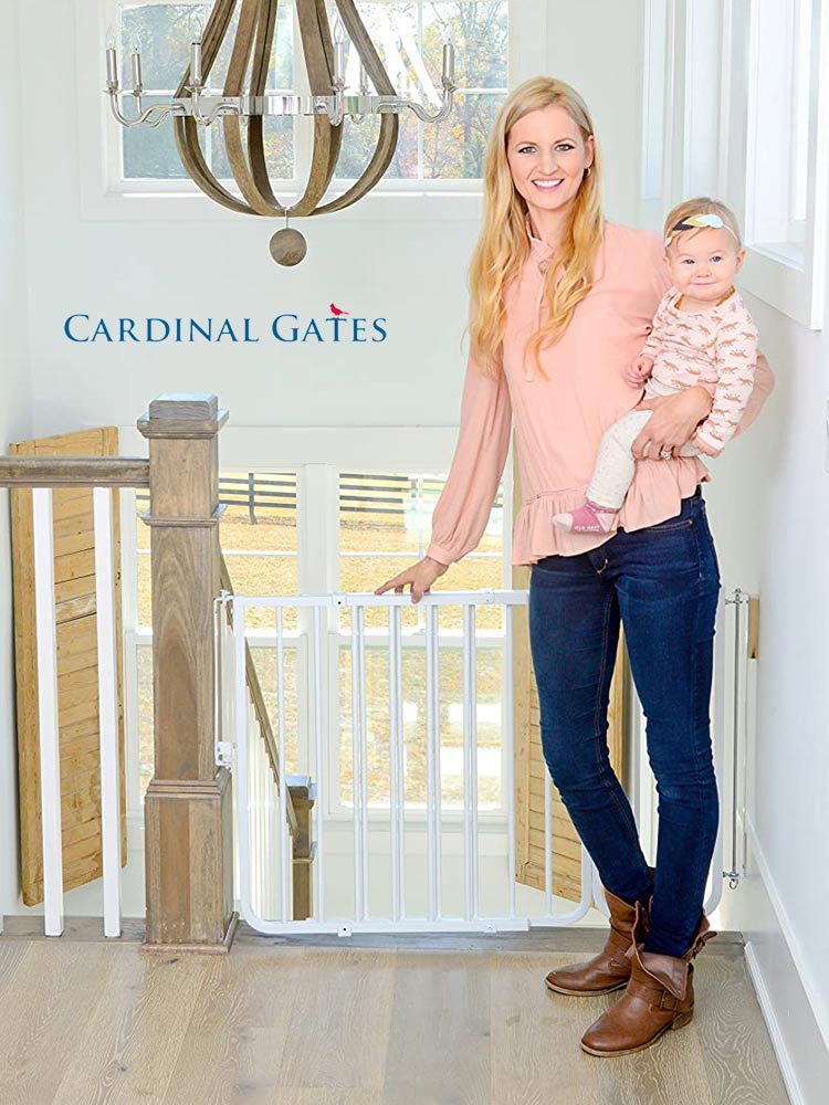 Cardinal Gates Stairway Baby Gate with woman holding baby