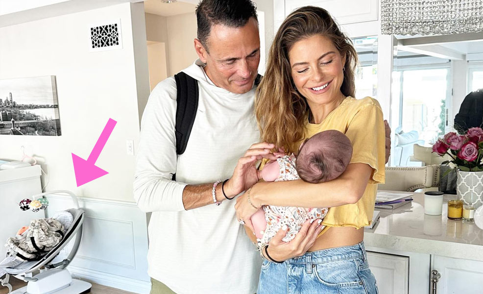 Maria Menounos and Keven Undergaro holding baby Athena with the 4moms mamaroo in the background