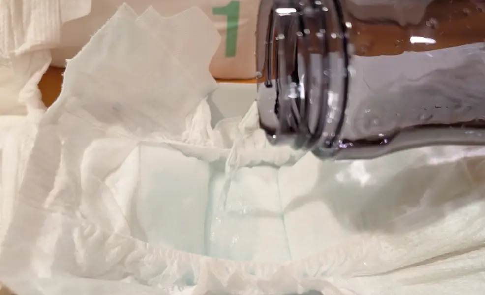 pouring water on coterie diaper test
