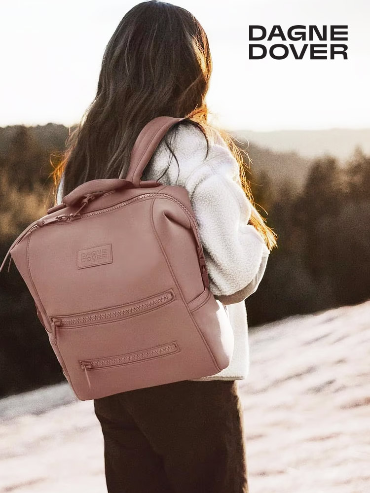 woman wearing a dagne dover indi backpack diaper bag