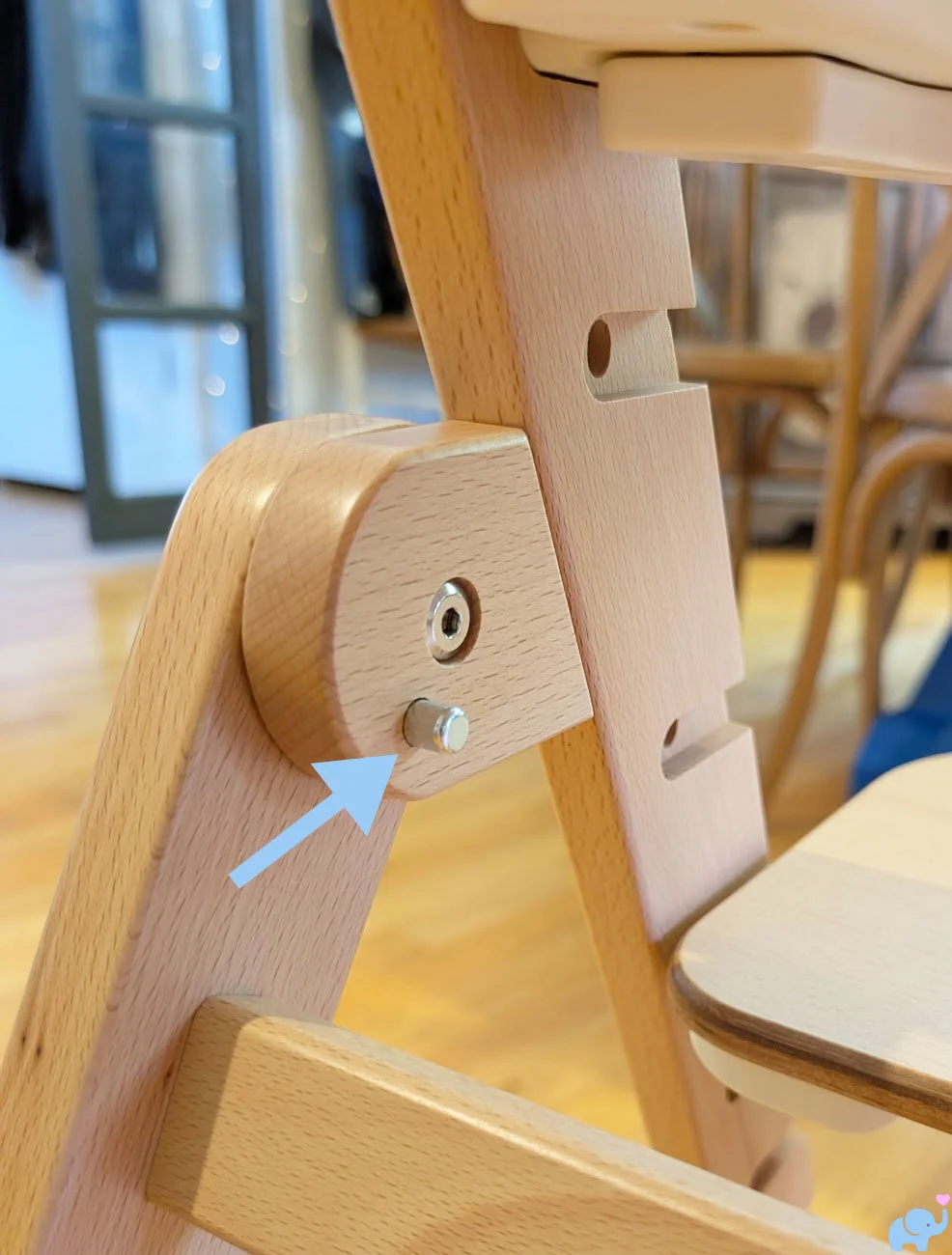 Stainless-steel folding release button on the Delta Children Crave High Chair frame