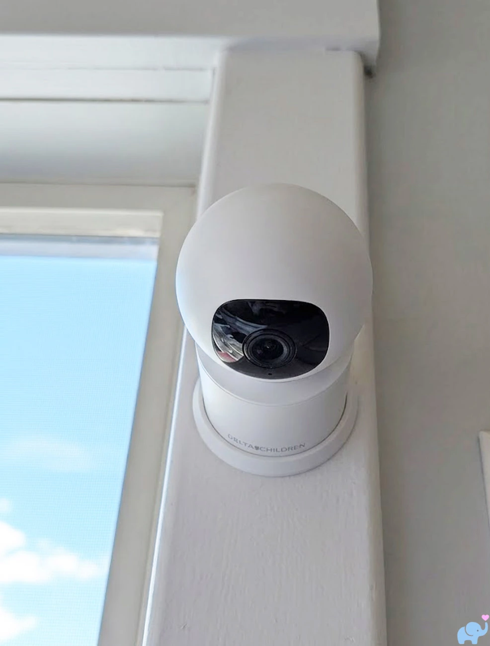Delta Children Smart Sleep camera attached to a nursery wall with the included bracket
