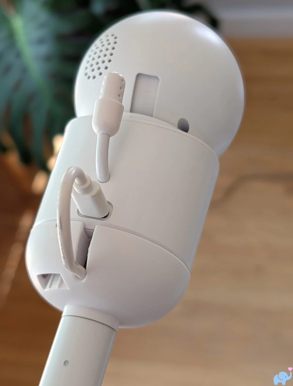 Rear of the Delta Children Smart Sleep camera showing its power cord antenna microphone and speaker