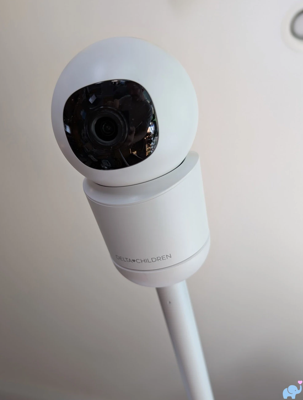 Delta Children Smart Sleep camera attached to the end of its tower arm