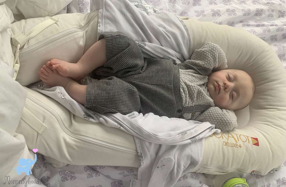 baby sleeping in a dockatot