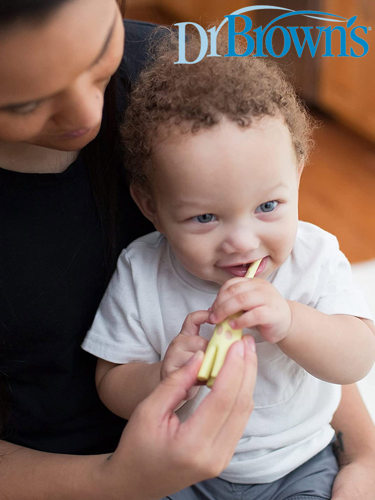 father helping baby brush teeth with the dr browns giraffe toothbrush