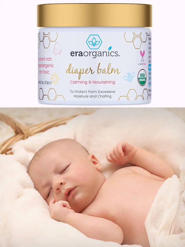 jar of era organics diaper balm next to a sleeping baby