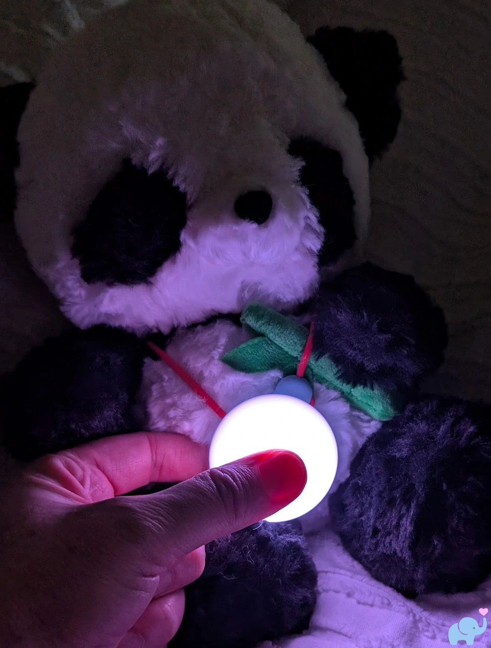 child squeezing the soft silicone button on the haivivi bubblepal to talk to the ai companion toy