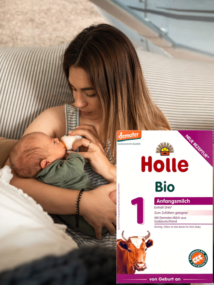 mother feeding a baby the holle bio stage 1 organic baby formula from a bottle