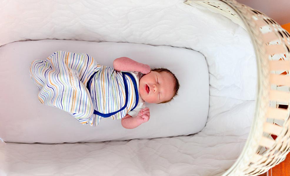 baby safe and sleeping in a bassinet