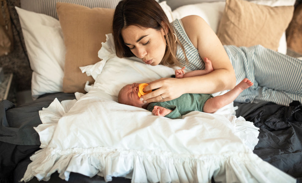 mom soothing baby with colic