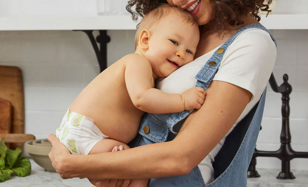 mom holding baby with cradle cap