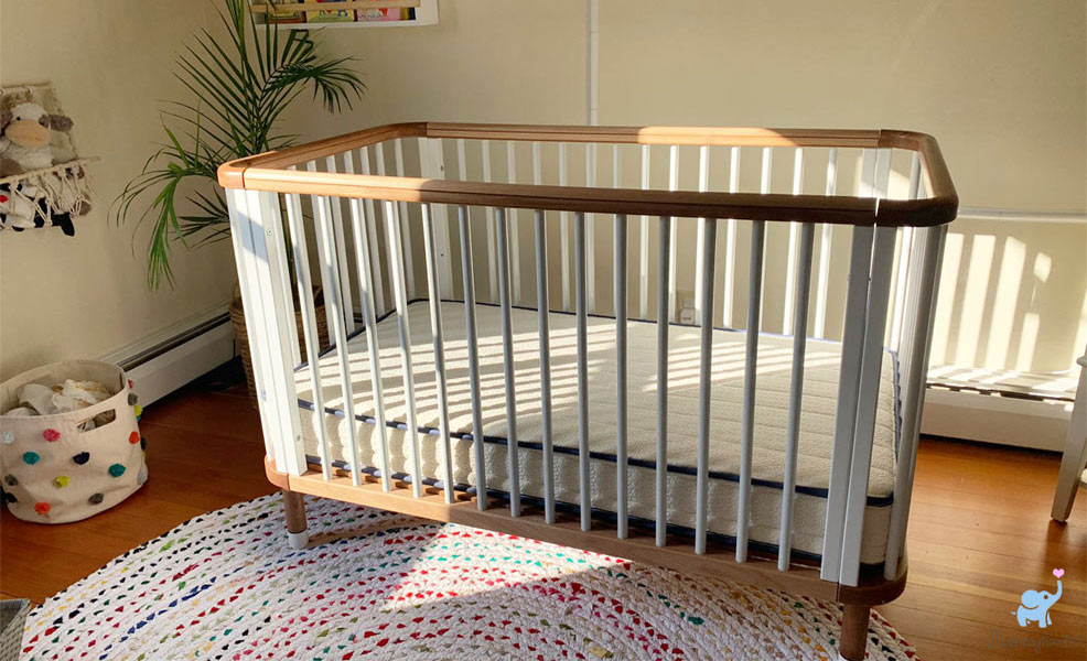 Crib mattress with outlet sheep on it