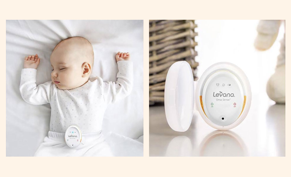 a baby sleeping with the levana oma sense monitor